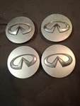 Set Genuine Silver 09 14 Infiniti QX80 QX56 Wheel Center Caps 40342-1LB4A. Fixed Price $30.00.