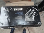 Thule 575 Universal Snowboard Carrier With Key Lock. Fixed Price $88.00.